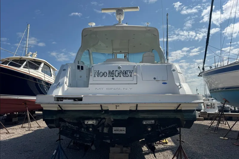 Slide: The Image of 2009 Cruisers Yachts 390 Sports Coupe on dry dock, rear view, clear sky background. - 6