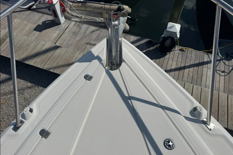 Slide: The Image of Bow of 2009 Cruisers Yachts 390 Sports Coupe at dock, showcasing deck details. - 14