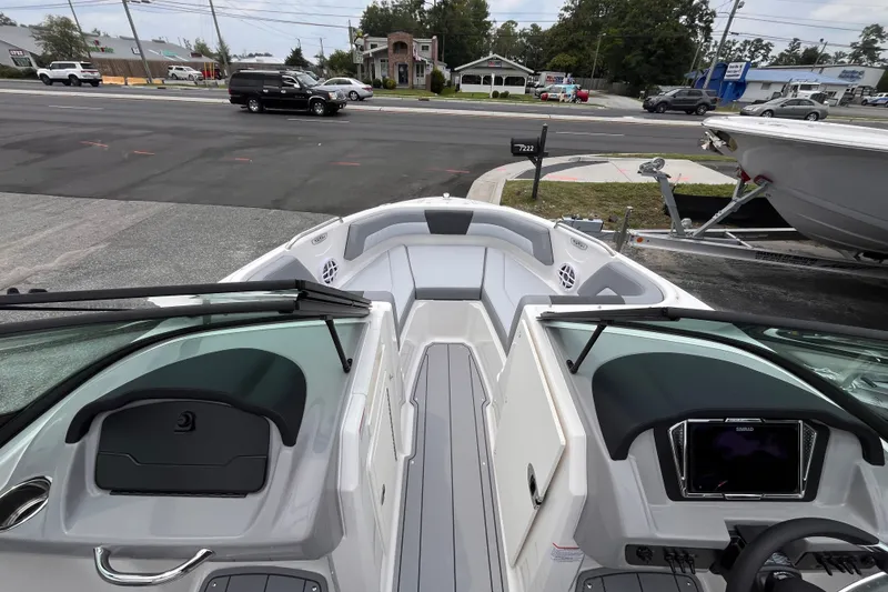 Slide: The Image of 2027 Chaparral 21 SSi OB boat interior, featuring sleek design and modern dashboard controls. - 11