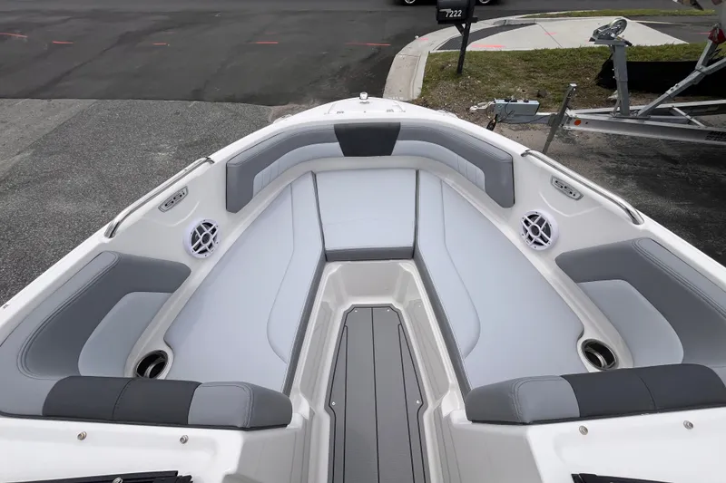 Slide: The Image of 2027 Chaparral 21 SSi OB boat interior with gray seating and speakers. - 15