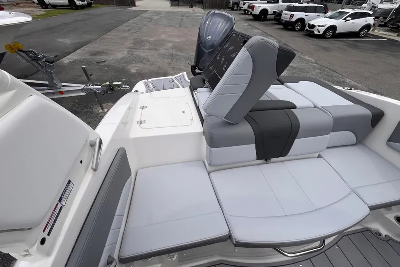 Slide: The Image of 2027 Chaparral 21 SSi OB boat interior with gray and white seating. - 19