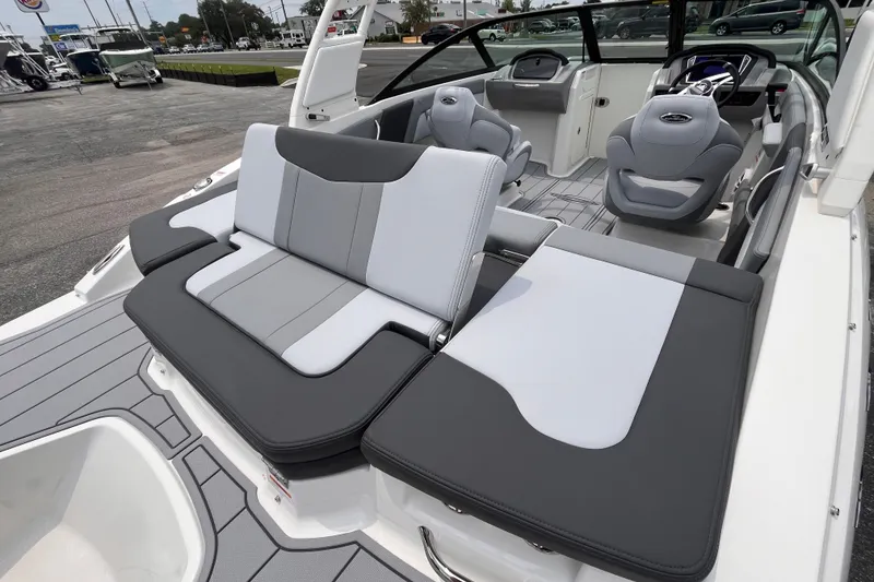 Slide: The Image of 2027 Chaparral 21 SSi OB boat interior with sleek seating and modern dashboard design. - 7