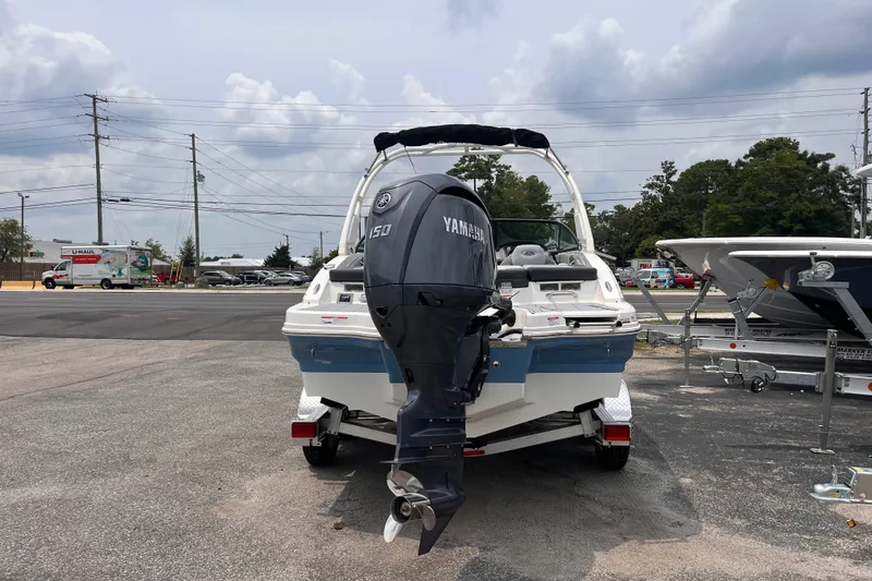 Slide: The Image of 2027 Chaparral 21 SSi OB boat with Yamaha 150 outboard motor in parking lot. - 4