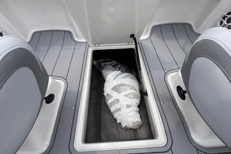 Slide: The Image of 2027 Chaparral 21 SSi OB boat interior with storage compartment and seating. - 17