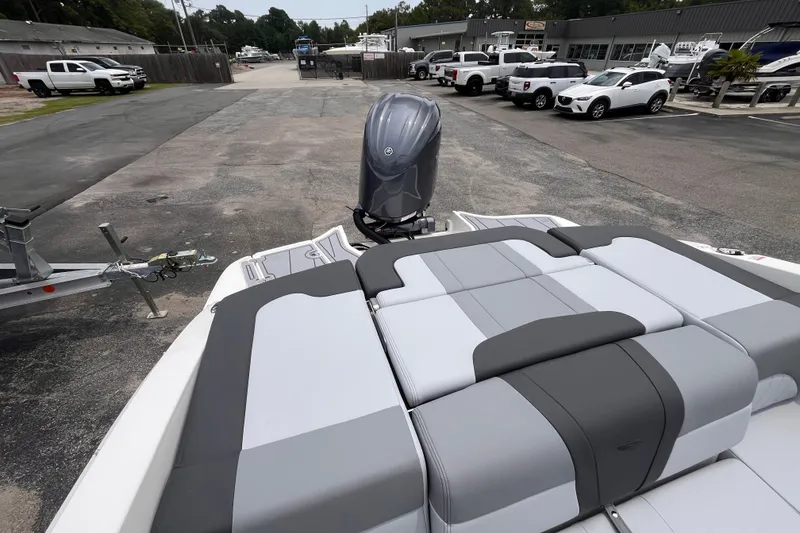 Slide: The Image of 2027 Chaparral 21 SSi OB boat with sleek seating and powerful outboard motor. - 8