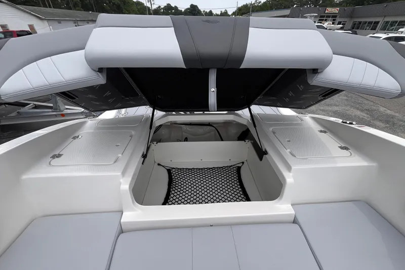 Slide: The Image of 2027 Chaparral 21 SSi OB boat interior storage compartment with open hatch. - 18