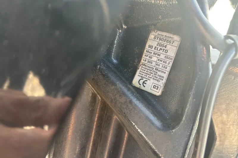 Slide: The Image of Label on a 2004 Nitro 700 LX SC boat engine, showing specifications and serial number. - 16