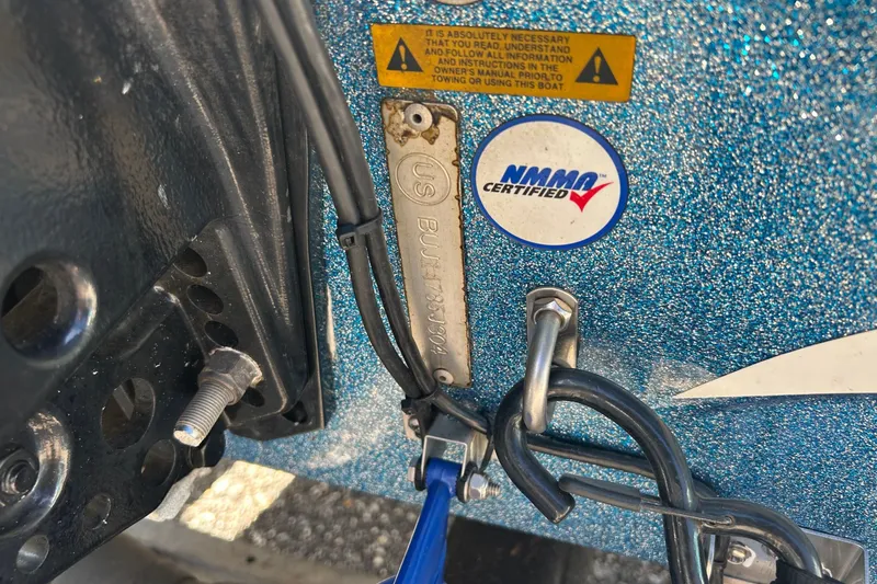 Slide: The Image of 2004 Nitro 700 LX SC boat with NMMA certification label and safety warning. - 15