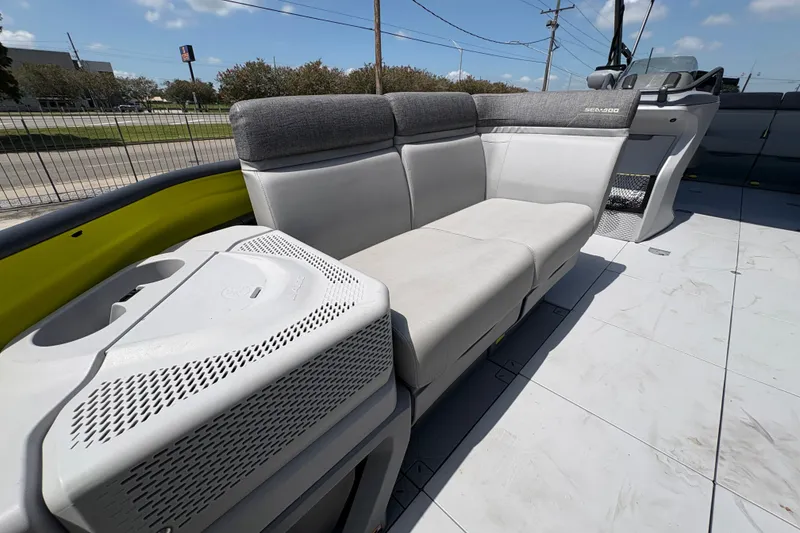 Slide: The Image of 2023 Seadoo Switch 21 boat interior with gray seating and modern design. - 11