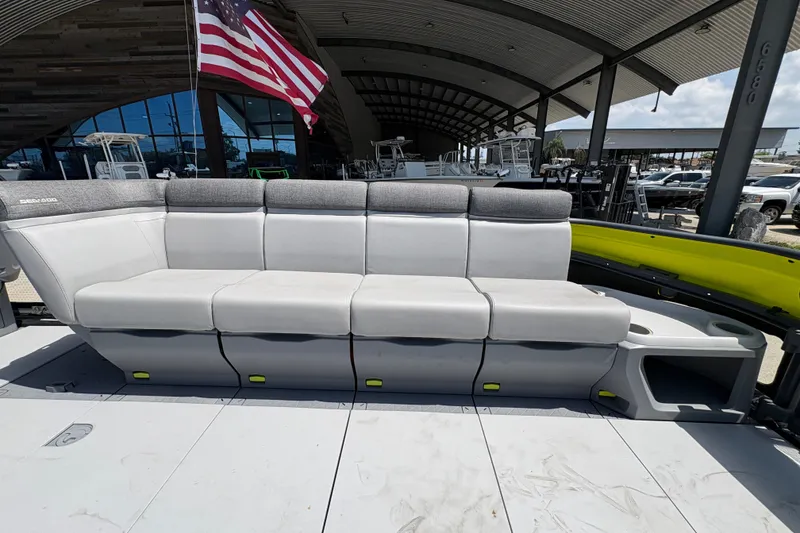 Slide: The Image of 2023 Seadoo Switch 21 boat seating with American flag in background. - 13