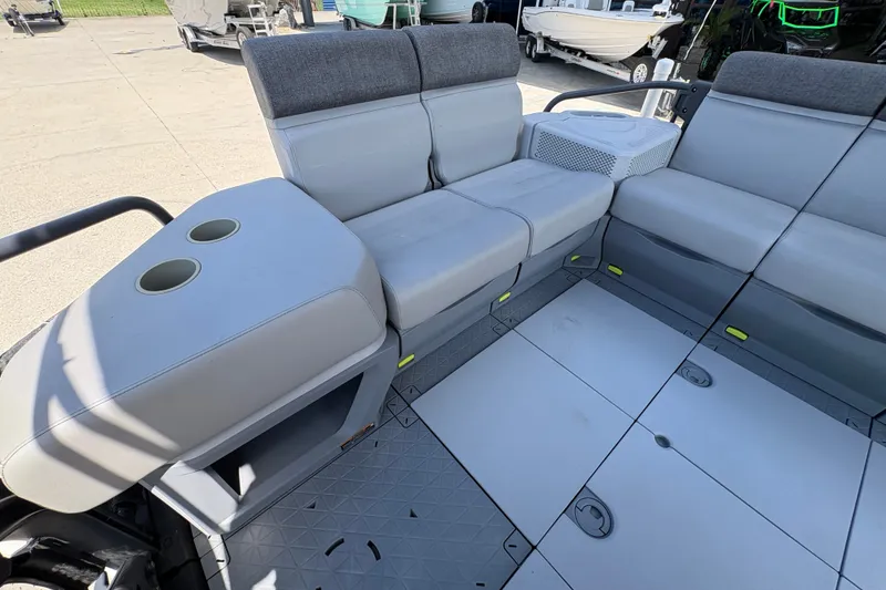 Slide: The Image of Interior seating of 2023 Seadoo Switch 21 boat with cup holders and storage. - 17