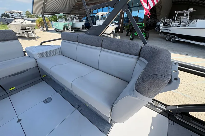 Slide: The Image of 2023 Seadoo Switch 21 boat interior with gray seating and modern design. - 16