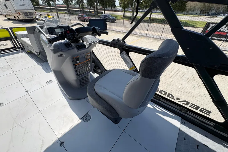 Slide: The Image of 2023 Seadoo Switch 21 cockpit with steering console and seating, showcasing modern design. - 18