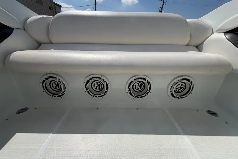 Slide: The Image of Rear seating area of a 2004 Baja 245 Performance boat with integrated speakers. - 14