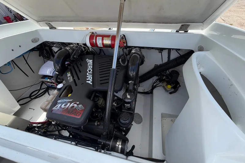 Slide: The Image of Engine compartment of a 2004 Baja 245 Performance boat with Mercury 496 MAG engine. - 18