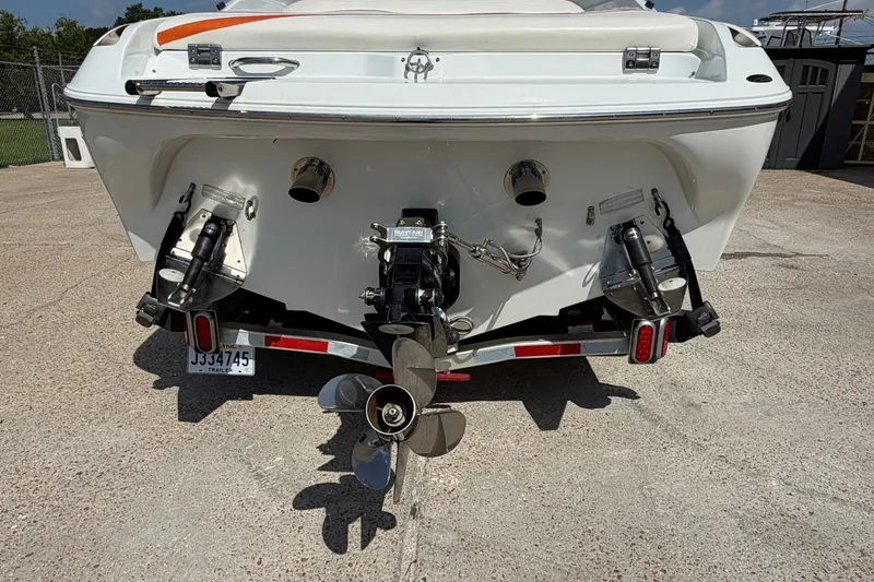 Slide: The Image of Rear view of a 2004 Baja 245 Performance boat with dual propellers. - 9