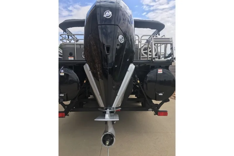 Slide: The Image of Rear view of 2023 Regency 250LE boat with powerful outboard motor. - 10
