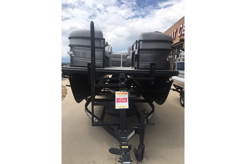 Slide: The Image of 2023 Regency 250LE pontoon boat on trailer, priced at $75,000, displayed outdoors. - 8