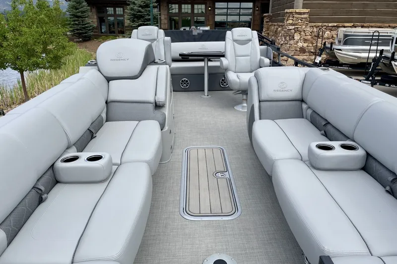 Slide: The Image of 2023 Regency 250LE pontoon boat with luxurious seating and modern design. - 3