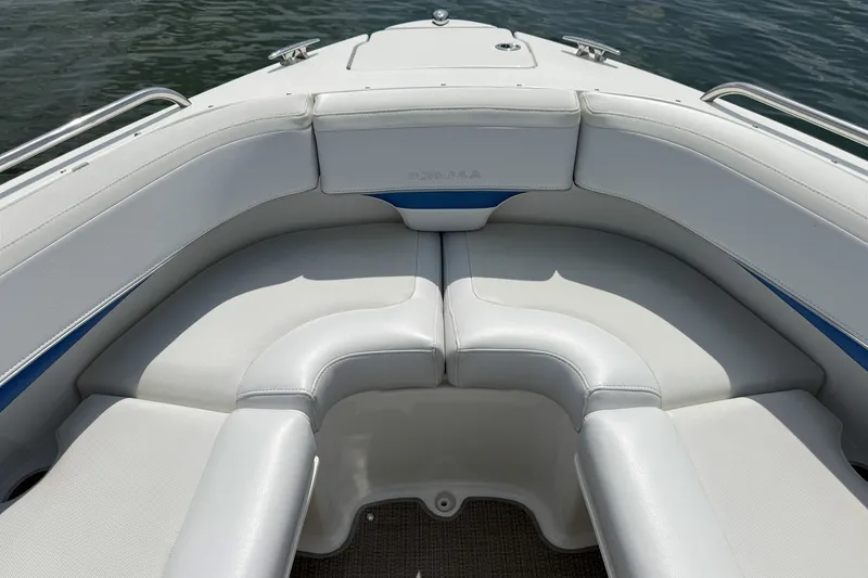 Slide: The Image of 2019 Formula 270 Bowrider boat interior with white cushioned seating and blue accents. - 15