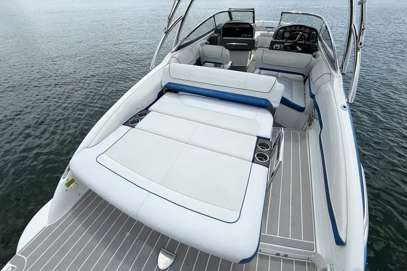 Slide: The Image of 2019 Formula 270 Bowrider boat interior with spacious seating and sleek design on water. - 16