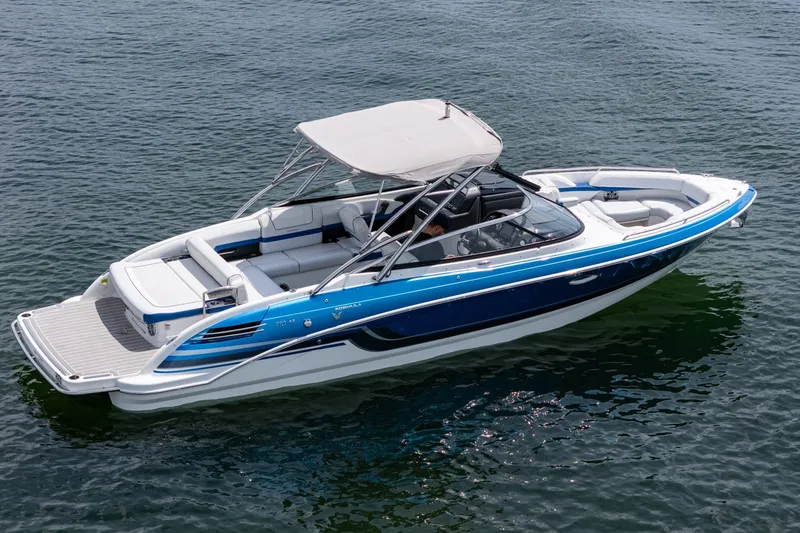 Slide: The Image of 2019 Formula 270 Bowrider boat on water, featuring sleek design and spacious seating. - 6