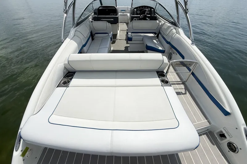 Slide: The Image of 2019 Formula 270 Bowrider boat interior with spacious seating and sleek design on calm water. - 20
