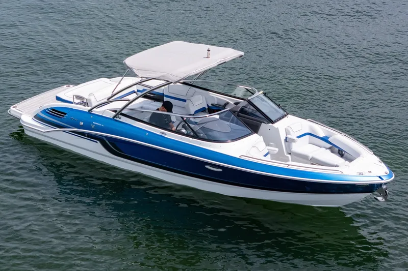 Slide: The Image of 2019 Formula 270 Bowrider boat with blue and white design on calm water. - 3