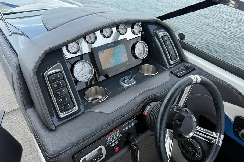 Slide: The Image of Dashboard of a 2019 Formula 270 Bowrider boat with gauges and navigation screen. - 11