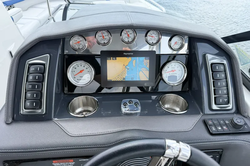 Slide: The Image of Dashboard of a 2019 Formula 270 Bowrider boat with gauges and navigation screen. - 12