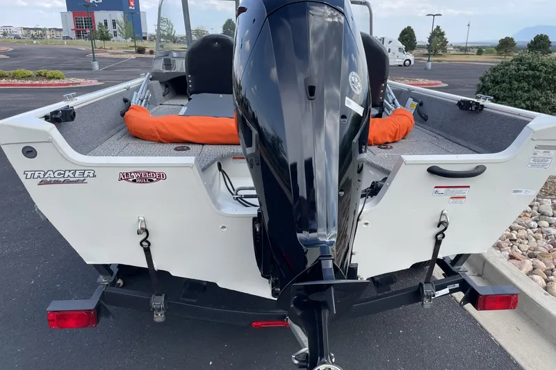 Slide: The Image of 2020 Tracker Pro Guide V-16 WT boat with outboard motor, parked on a trailer. - 4
