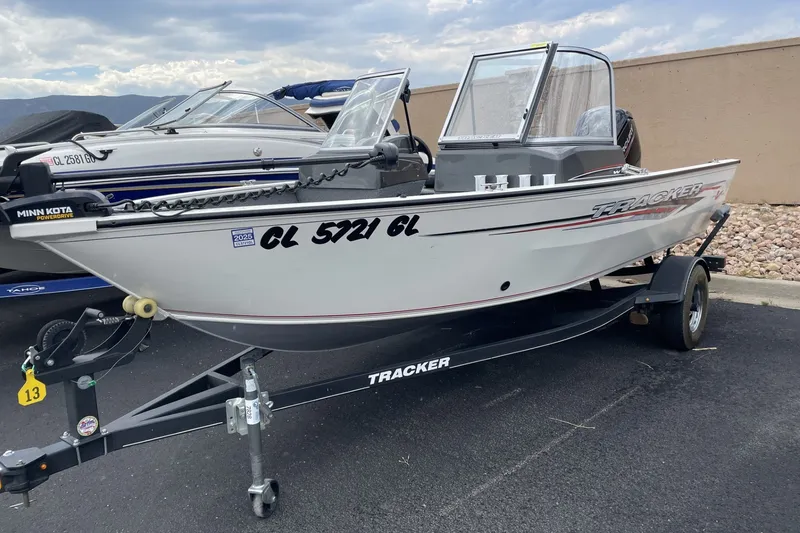 The Image of 2020 Tracker Pro Guide V-16 WT boat on trailer, featuring Minn Kota PowerDrive motor. - 1