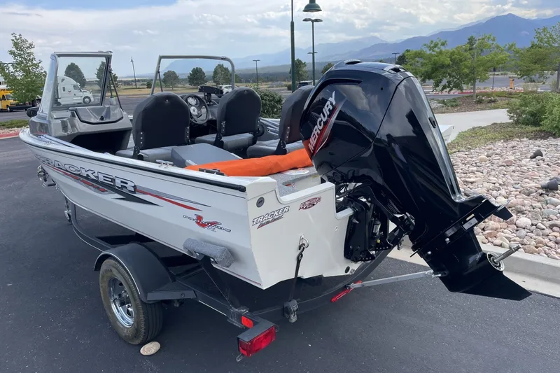Slide: The Image of 2020 Tracker Pro Guide V-16 WT boat with Mercury outboard motor on a trailer. - 3