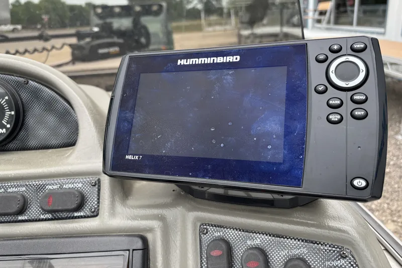Slide: The Image of Humminbird Helix 7 fish finder on 2001 Lund Mr. Pike 16 boat dashboard. - 9