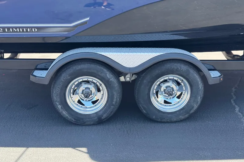 Slide: The Image of Trailer wheels of a 2017 Yamaha Boats 212 Limited on pavement. - 35