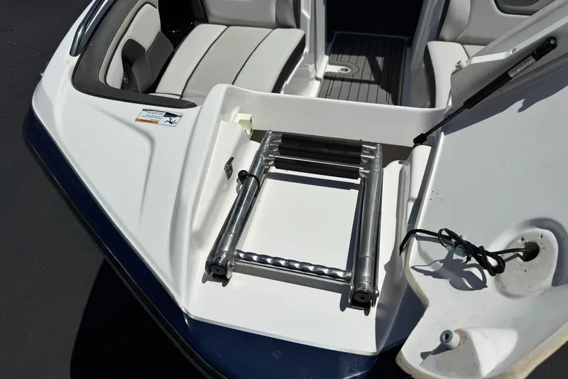 Slide: The Image of 2017 Yamaha Boats 212 Limited with open hatch and retractable ladder. - 13
