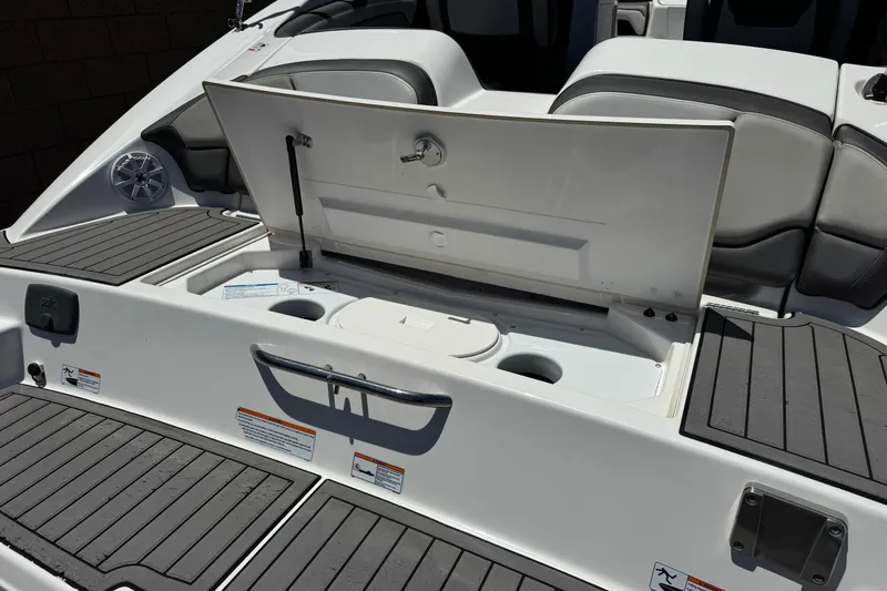 Slide: The Image of 2017 Yamaha Boats 212 Limited swim platform with storage compartment open. - 7