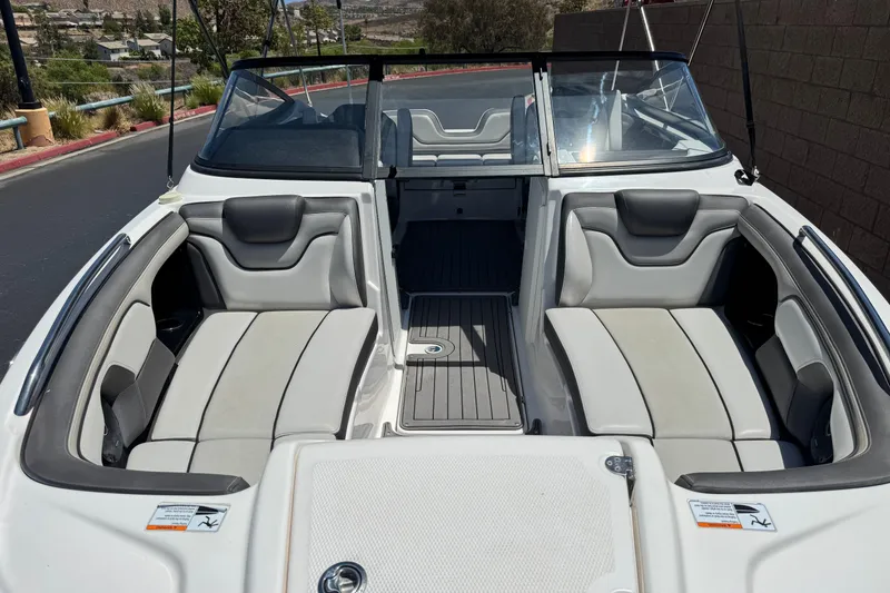 Slide: The Image of 2017 Yamaha Boats 212 Limited interior with spacious seating and sleek design. - 11