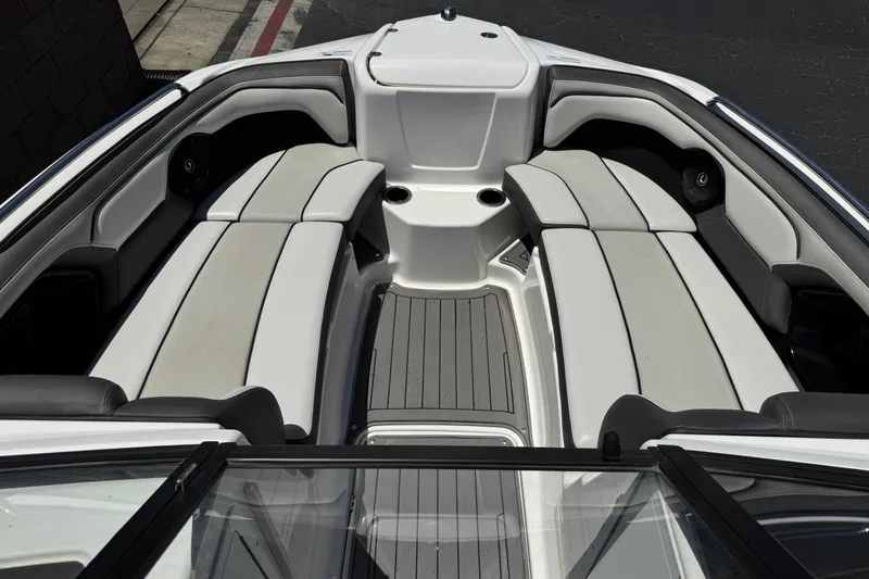 Slide: The Image of 2017 Yamaha Boats 212 Limited interior with spacious seating and sleek design. - 14