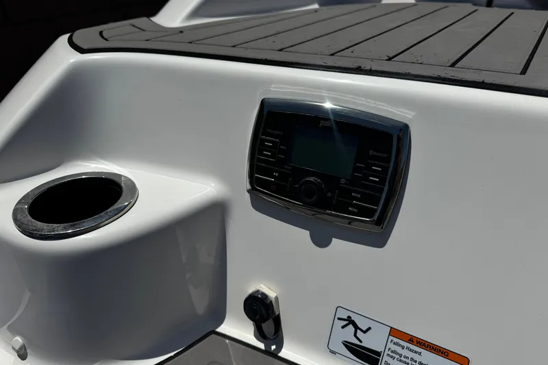 Slide: The Image of 2017 Yamaha Boats 212 Limited dashboard with control panel and cup holder. - 8