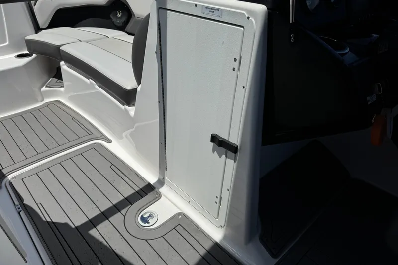Slide: The Image of 2017 Yamaha Boats 212 Limited interior with seating and storage compartment. - 33