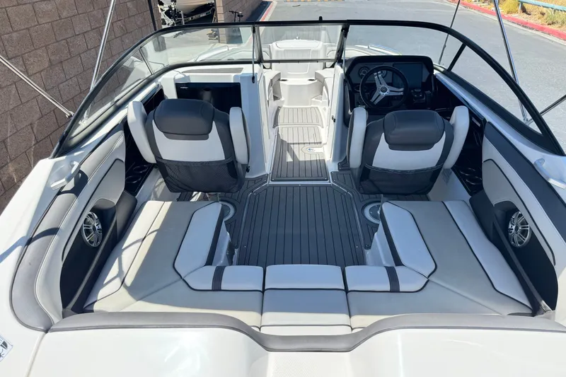 Slide: The Image of 2017 Yamaha Boats 212 Limited interior with seating and steering wheel. - 10