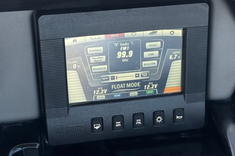 Slide: The Image of Yamaha Boats 2017 212 Limited dashboard display showing radio and system information. - 30