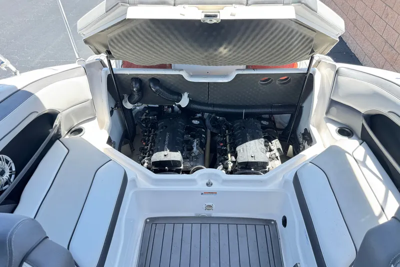 Slide: The Image of Engine compartment of a 2017 Yamaha Boats 212 Limited, showcasing dual engines. - 19