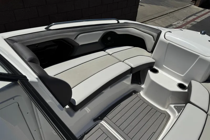 Slide: The Image of Interior seating of a 2017 Yamaha Boats 212 Limited, featuring sleek design and cup holders. - 15