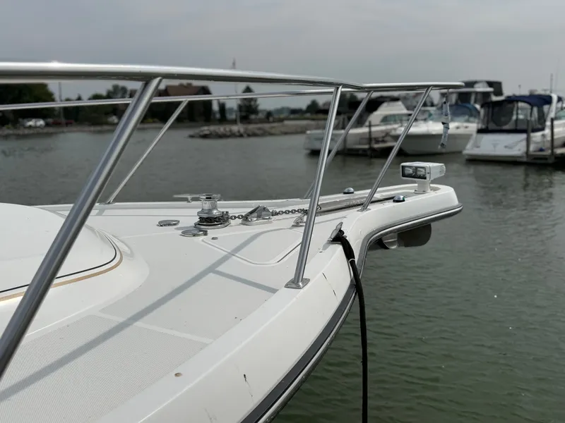 Slide: The Image of The foredeck of a 1999 Tiara Yachts 4000 Express with stainless steel railing and anchor windlass. - 8