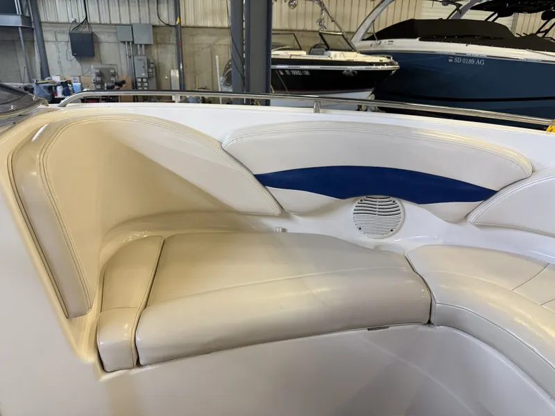 Slide: The Image of Interior view of a 2001 Chaparral 219 boat with beige and blue seating. - 44