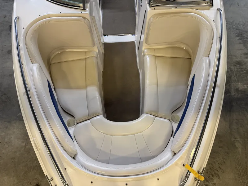 Slide: The Image of The image shows the bow area of a 2001 Chaparral 219 boat with beige seating. - 39