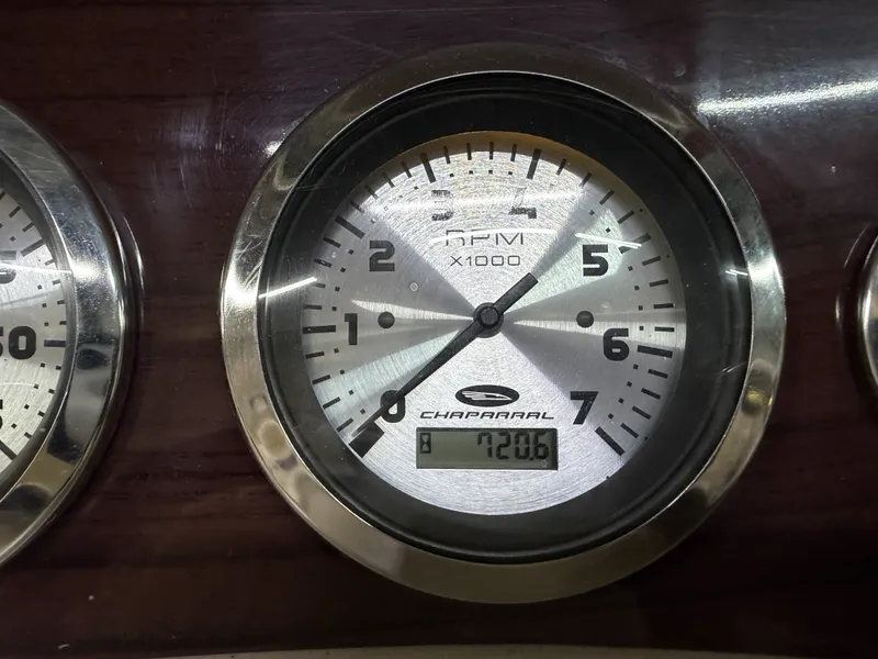 Slide: The Image of Close-up of a tachometer with Chaparral logo, displaying 7206 RPM. - 35