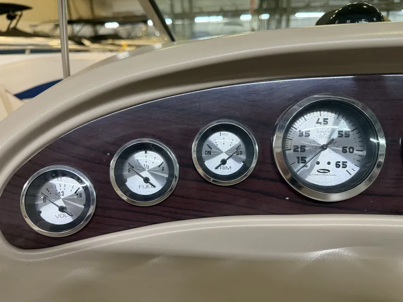 Slide: The Image of Close-up of a 2001 Chaparral 219 dashboard featuring various gauges. - 33